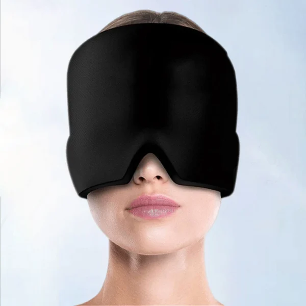 Woman wearing a black cold therapy gel mask for headache and migraine relief, covering the entire forehead and eyes.